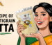 Illustrated woman in a green and yellow saree holding a packet of Nitara Multigrain Atta, smiling. The text reads "Recipe of Multigrain Atta" with wheat grains in the background.